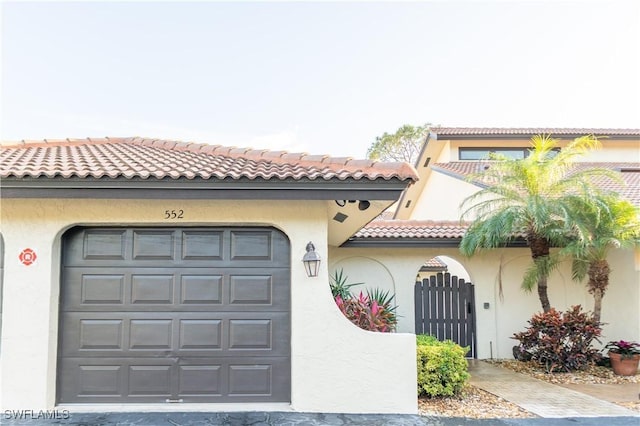 mediterranean / spanish house featuring a garage