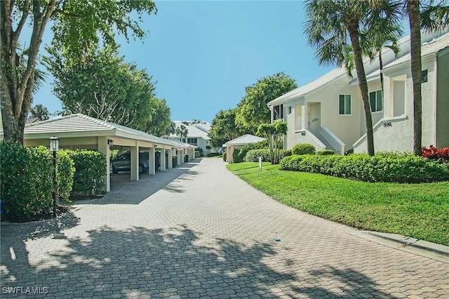 view of home's community with a lawn