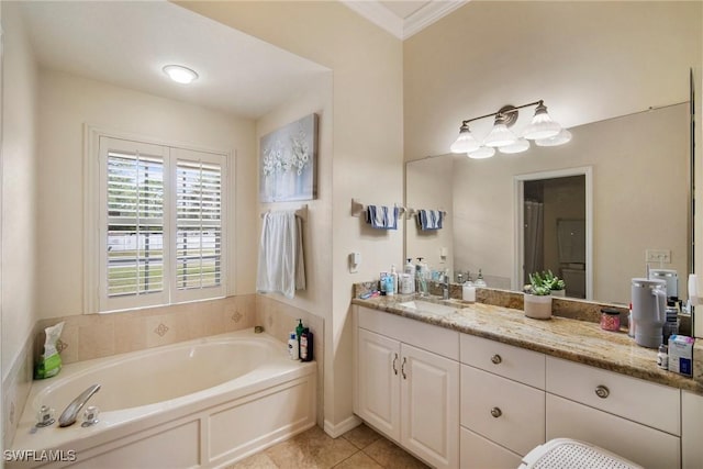 bathroom featuring vanity, tile patterned floors, a bathtub, and crown molding