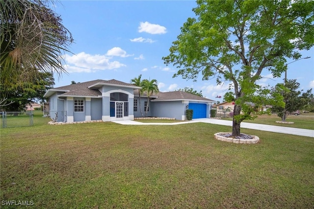 view of front of property with a garage and a front yard