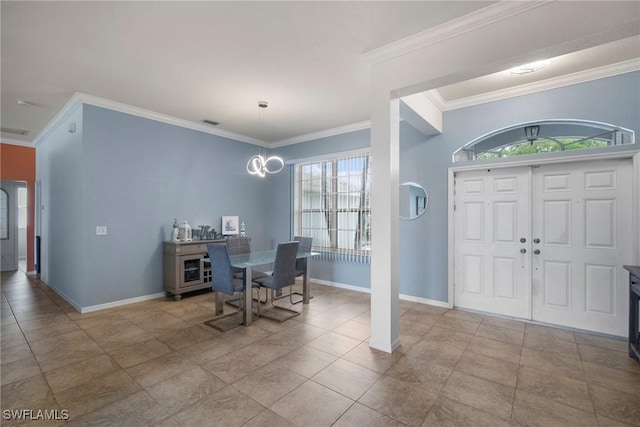 foyer entrance featuring light tile patterned floors, plenty of natural light, and crown molding