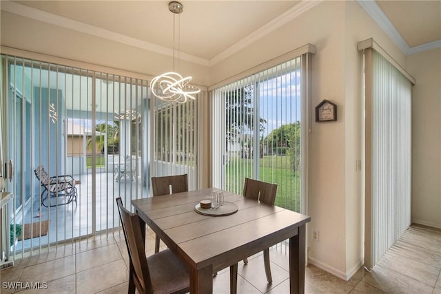 dining space featuring light tile patterned floors, an inviting chandelier, and ornamental molding