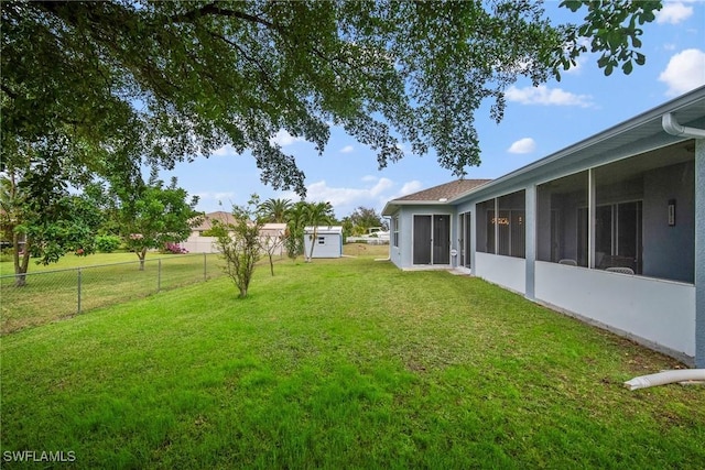 view of yard featuring a sunroom