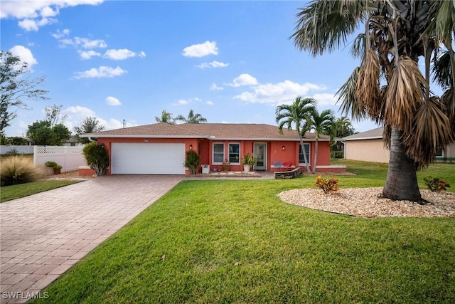 single story home with a garage and a front yard