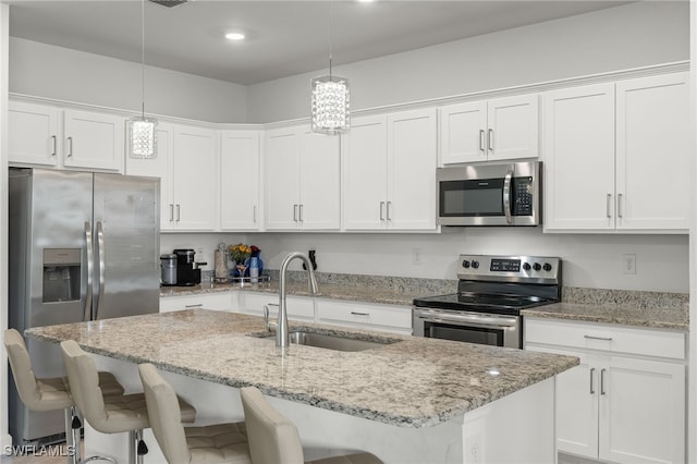 kitchen featuring white cabinetry, sink, and appliances with stainless steel finishes