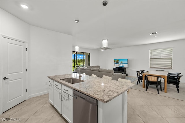 kitchen featuring white cabinetry, dishwasher, sink, hanging light fixtures, and a kitchen island with sink