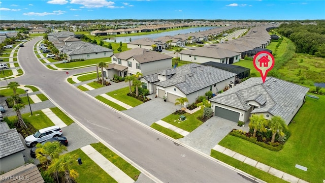 birds eye view of property with a water view