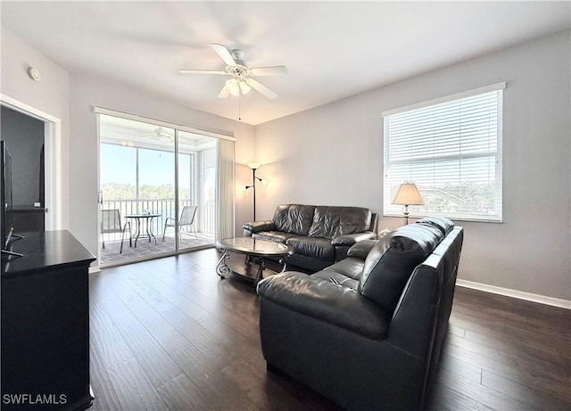 living room with dark hardwood / wood-style floors and ceiling fan