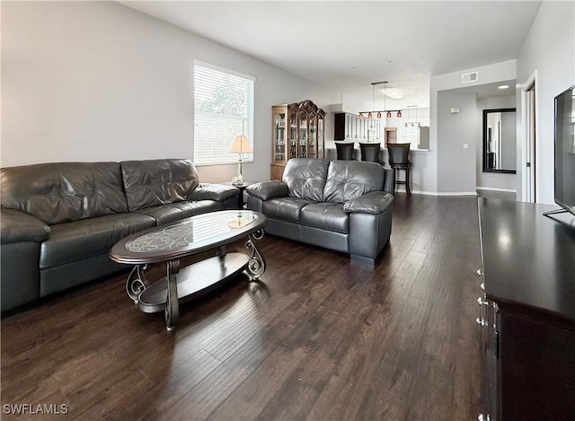 living room featuring dark hardwood / wood-style floors