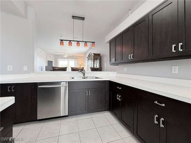 kitchen with dishwasher, sink, ceiling fan, light tile patterned floors, and kitchen peninsula