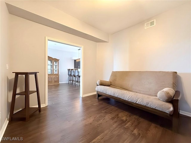 living area with dark hardwood / wood-style flooring