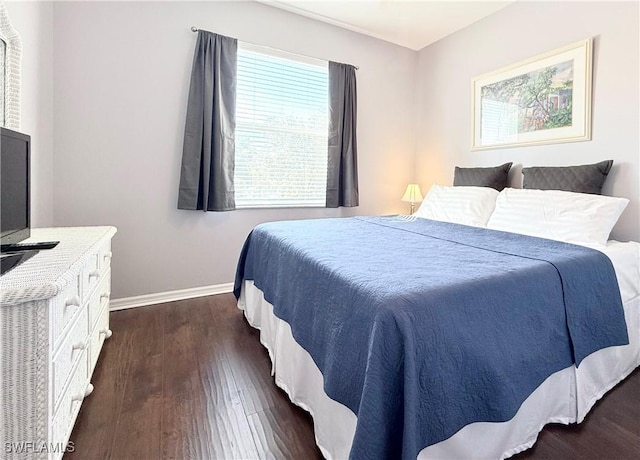 bedroom featuring dark hardwood / wood-style flooring