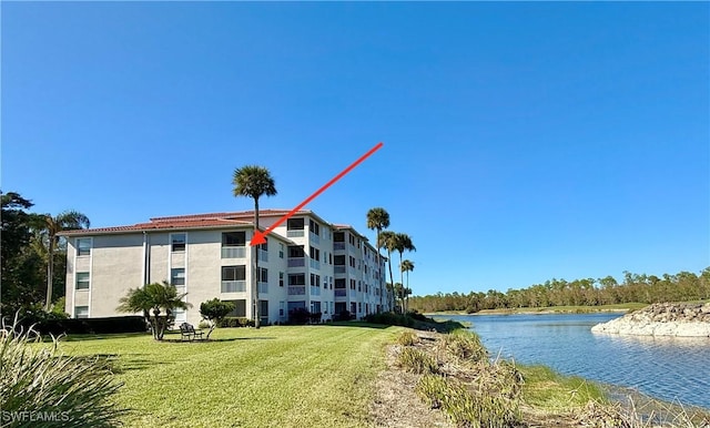 view of building exterior featuring a water view