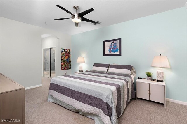 bedroom with ceiling fan and light colored carpet