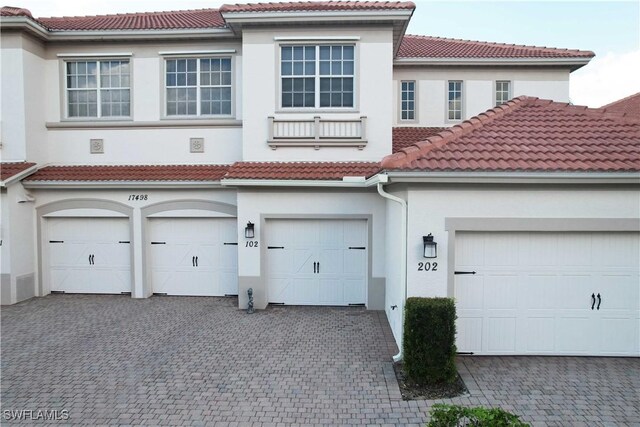 exterior space featuring decorative driveway