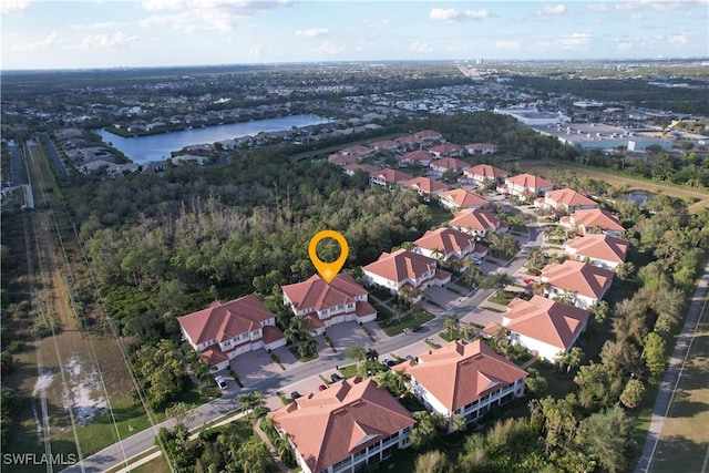 bird's eye view featuring a water view and a residential view