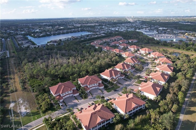 aerial view with a water view and a residential view