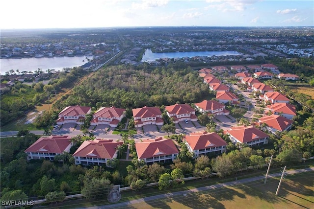 bird's eye view with a water view and a residential view