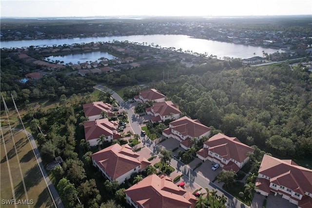 drone / aerial view with a water view