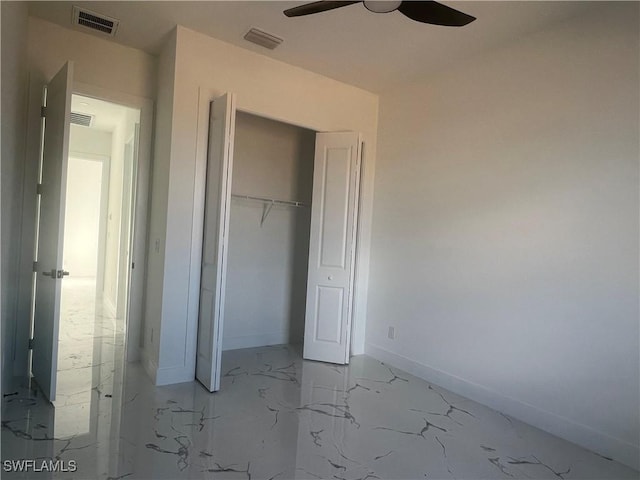 unfurnished bedroom featuring ceiling fan and a closet