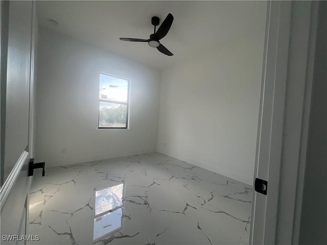 spare room with ceiling fan