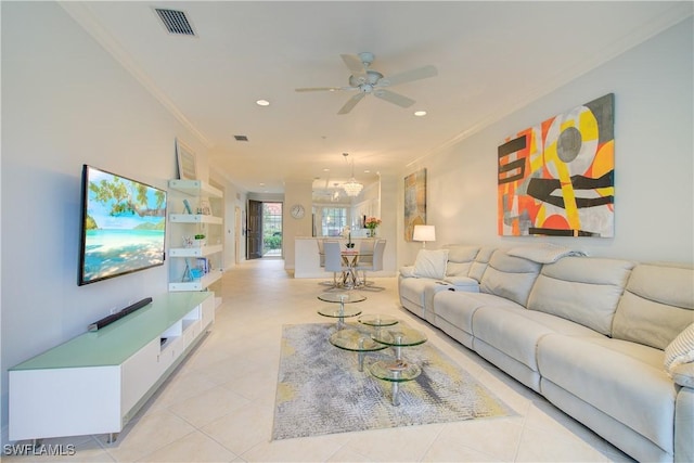 living room featuring crown molding, built in shelves, light tile patterned floors, and ceiling fan