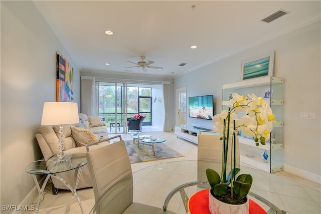 tiled living room featuring ceiling fan and ornamental molding