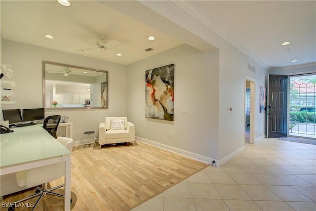 office area with light tile patterned floors, ceiling fan, and ornamental molding