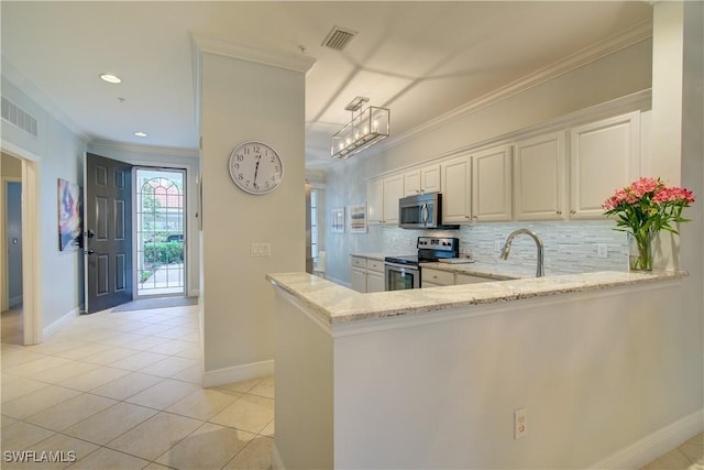 kitchen featuring kitchen peninsula, light tile patterned floors, light stone countertops, decorative backsplash, and stainless steel appliances