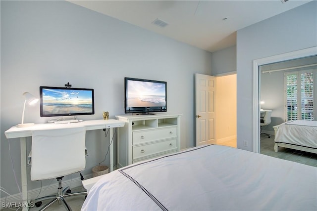 bedroom with visible vents and baseboards