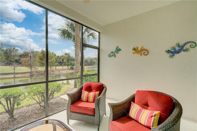 sunroom / solarium with a water view