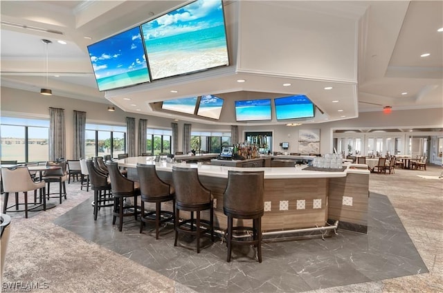 bar featuring marble finish floor, ornamental molding, a towering ceiling, and recessed lighting