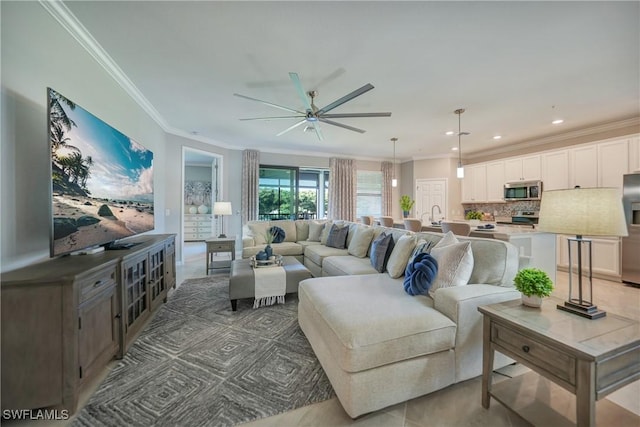 living room featuring ceiling fan and crown molding