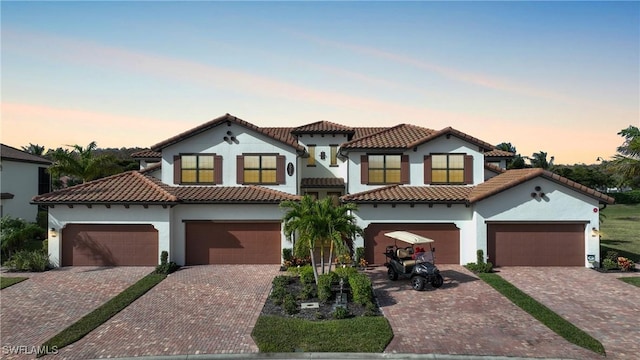 mediterranean / spanish-style home featuring a garage