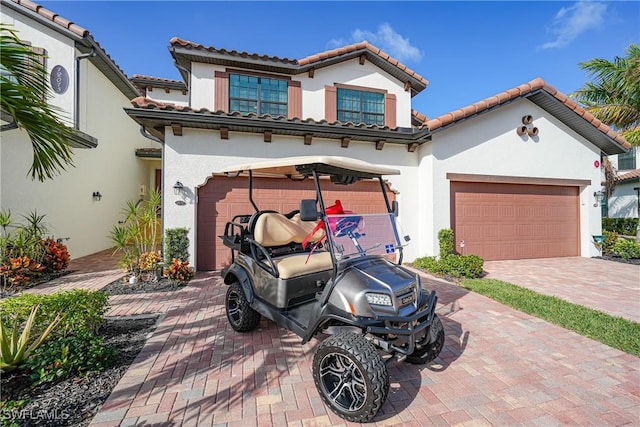 mediterranean / spanish-style house featuring a garage