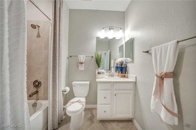 full bathroom featuring tile patterned floors, vanity, toilet, and shower / tub combo