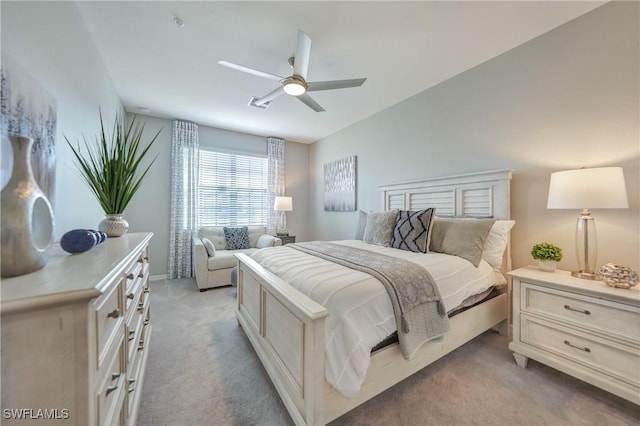 bedroom featuring ceiling fan, lofted ceiling, and light carpet