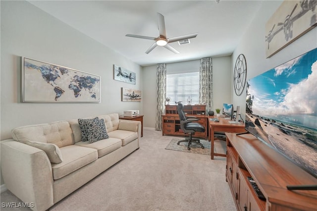 carpeted office with ceiling fan