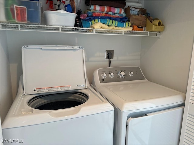 washroom with washer and dryer