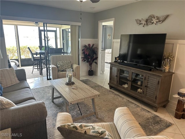 tiled living room featuring ceiling fan