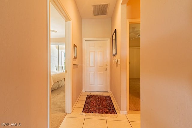 hallway with light tile patterned floors