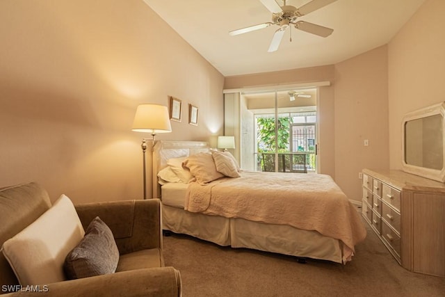 carpeted bedroom with ceiling fan and vaulted ceiling