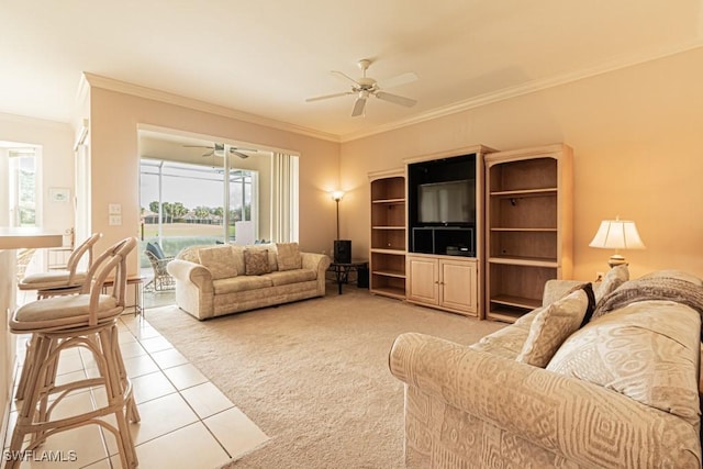 living room with light colored carpet, ceiling fan, and crown molding