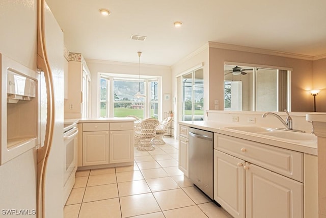 kitchen featuring white refrigerator with ice dispenser, sink, hanging light fixtures, stainless steel dishwasher, and ornamental molding