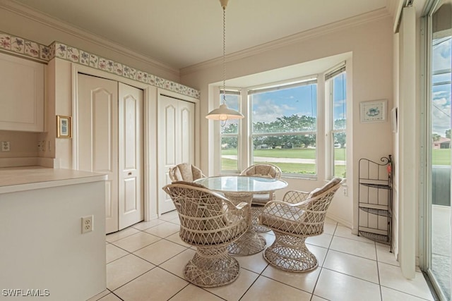 tiled dining room with crown molding