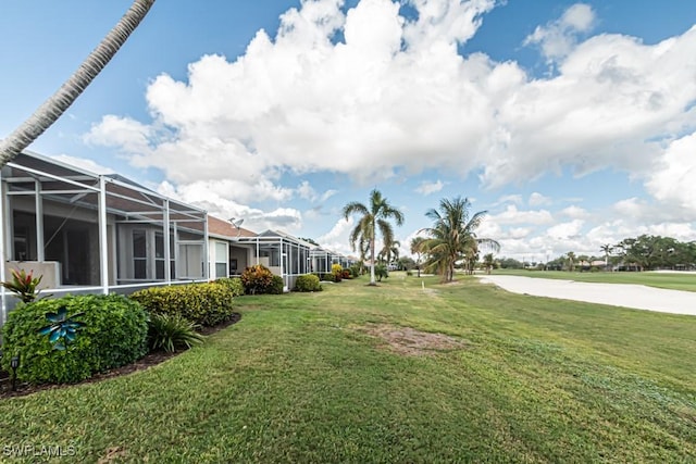 view of yard with a lanai