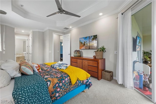 bedroom with connected bathroom, a raised ceiling, ceiling fan, and crown molding