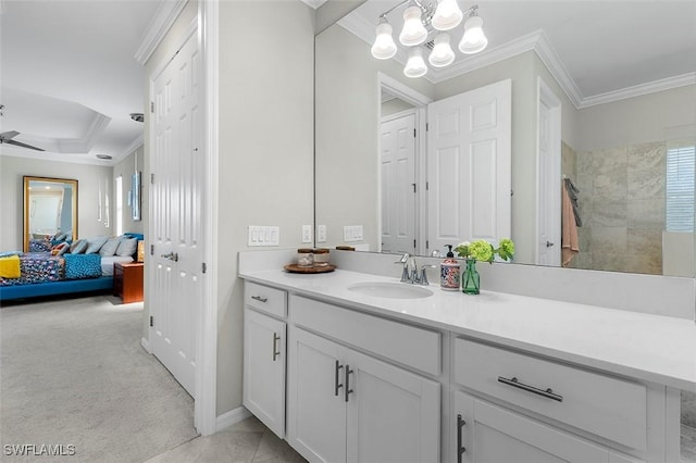 bathroom featuring vanity, a shower, crown molding, and ceiling fan with notable chandelier