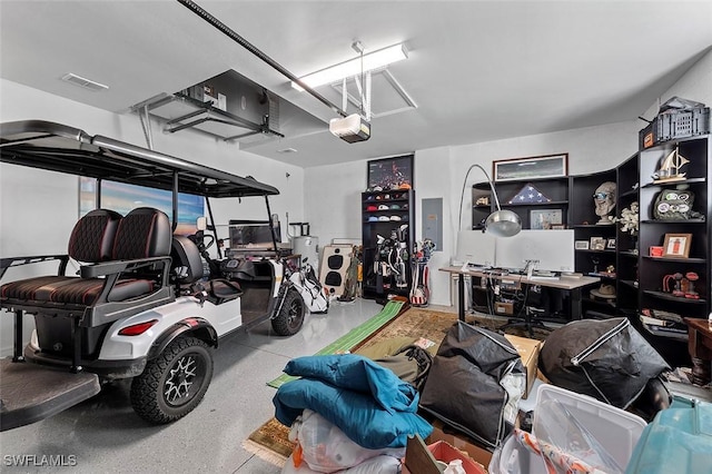 garage featuring electric panel and a garage door opener