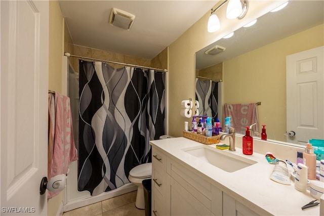 bathroom featuring a shower with curtain, tile patterned flooring, vanity, and toilet